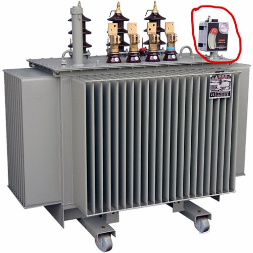 Temperature monitoring thermometer mounted on top of oil-filled power transformer tank above core and windings for measuring top oil temperature and hot-spot temperature estimation