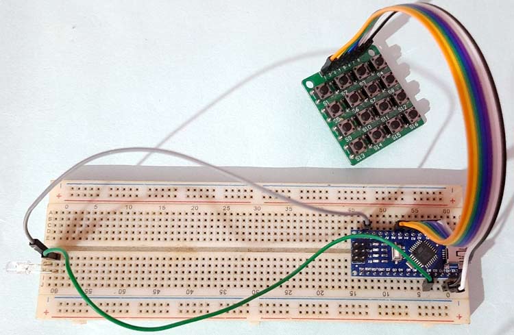Physical Li-Fi transmitter hardware setup showing Arduino board connected to 4x4 keypad and LED on breadboard