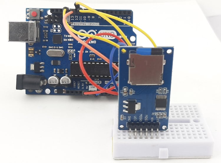 Arduino UNO with micro SD card module physical connection demonstration showing breadboard wiring and component placement
