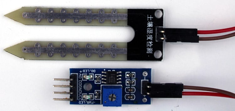 Complete soil moisture sensor module with probe connections and LED indicators