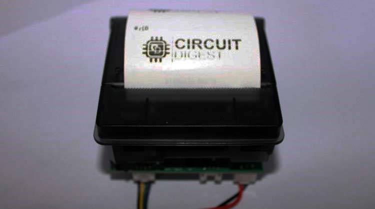 Thermal printer connected to Raspberry Pi showing serial TTL connection for receipt printing project