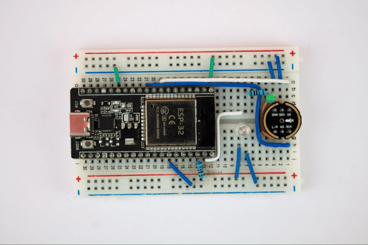 ESP32 voice recognition offline system with Edge Impulse showing complete hardware setup with INMP441 microphone module and ESP32 development board