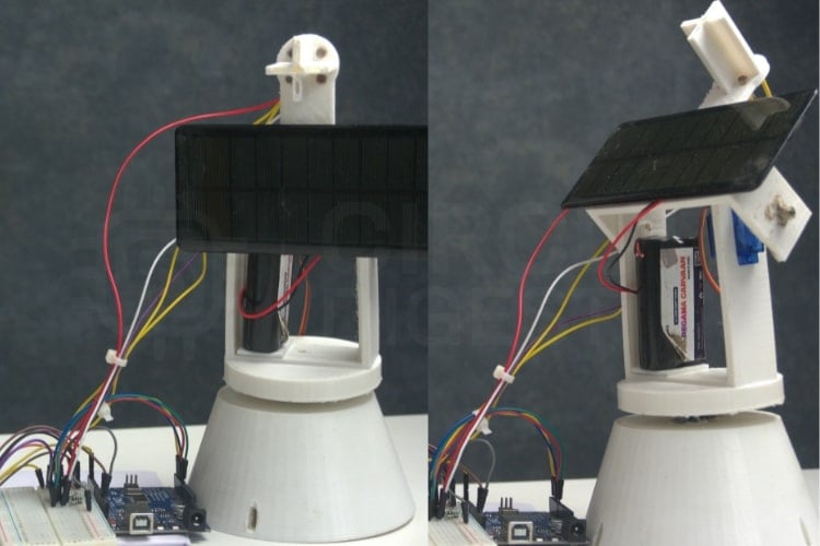 Complete dual axis solar tracker system setup showing Arduino UNO, servos, LDR sensors and solar panel