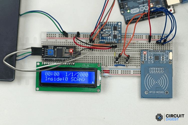 RFID attendance system home screen showing date, time and scan prompt