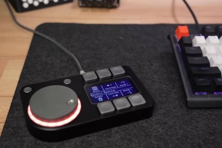DIY Macro pad with six buttons, an OLED display, and a rotary knob with RGB lighting